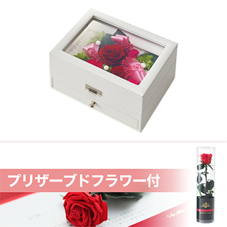 【東日本エリア対象】高級感のあるレザー調のオルゴールボックスにプリザーブドフラワーをアレンジしました。「花のワルツ」のメロディが流れます。